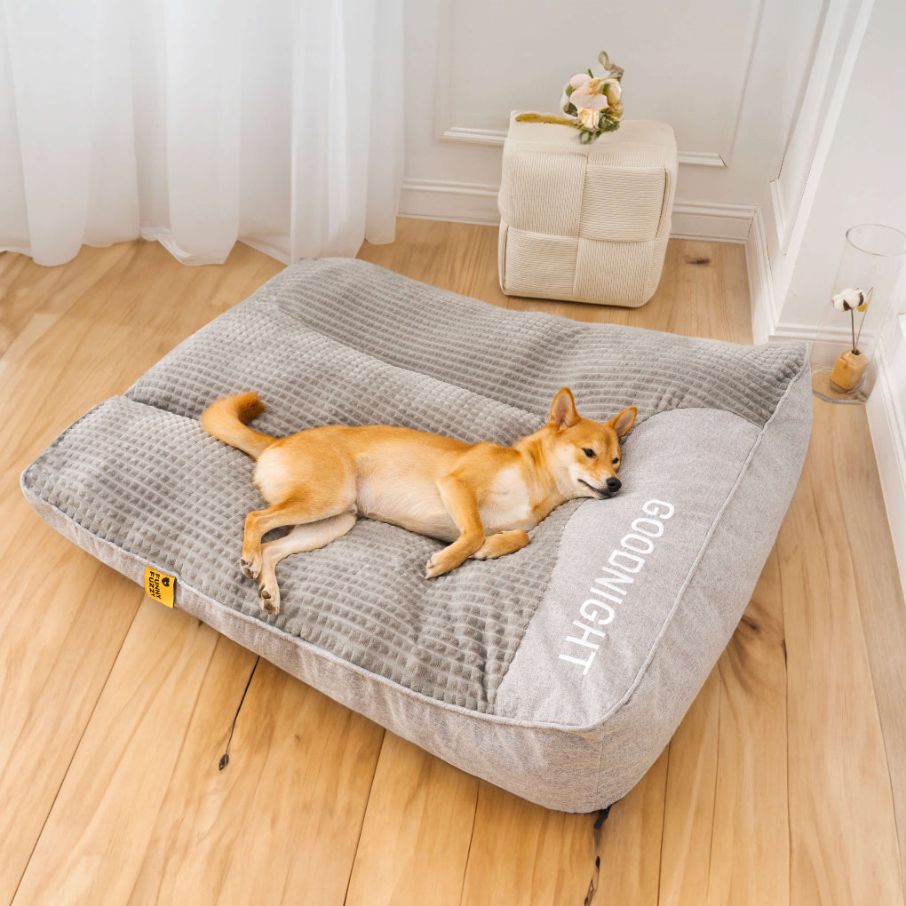 Gray durable orthopedic pet bed offering superior joint support and comfort with a thick, supportive cushion.