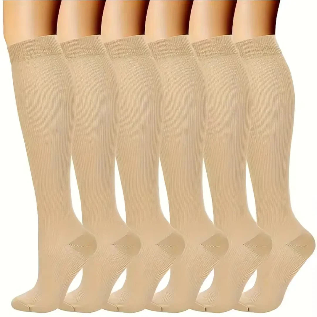 "Calze a compressione graduata donna in sei colori, traspiranti, migliorano circolazione e riducono gonfiore."