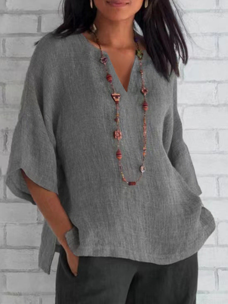 Camicetta blu in lino per donna, scollo a V, stile moderno ed elegante, perfetta per ogni occasione, comoda e traspirante.