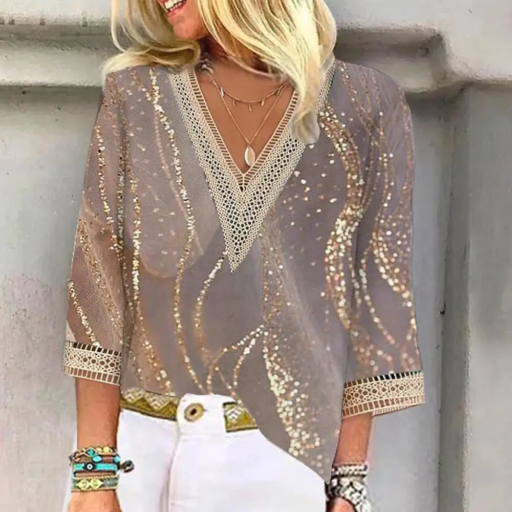 "Camicetta estiva donna con scollo a V, maniche leggere, design elegante in tessuto fluido. Perfetta per look casual e formal