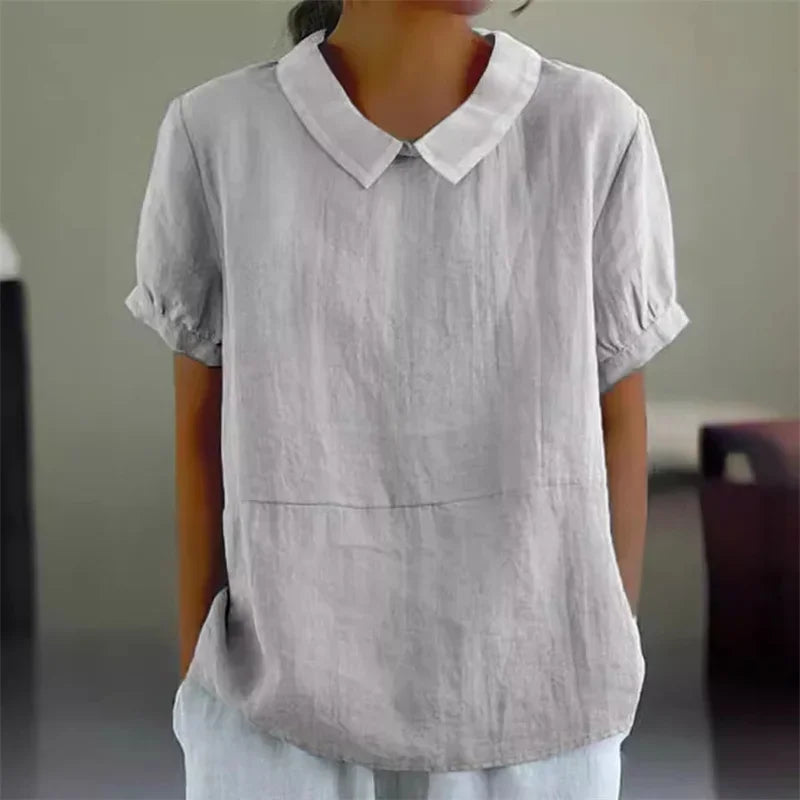 "Camicetta estiva donna lino cotone, design a maniche corte, colletto classico, blu, perfetta per look casual e raffinati."