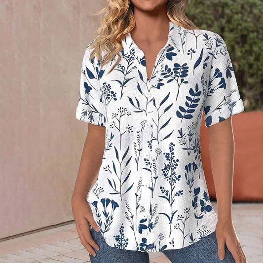 "Camicetta floreale donna estiva con stampa colorata, tessuto leggero e maniche corte, perfetta per look eleganti e casual."
