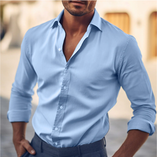 "Camicia elegante da uomo in cotone bianco, taglio classico, ideale per look casual e formali, colletto strutturato."