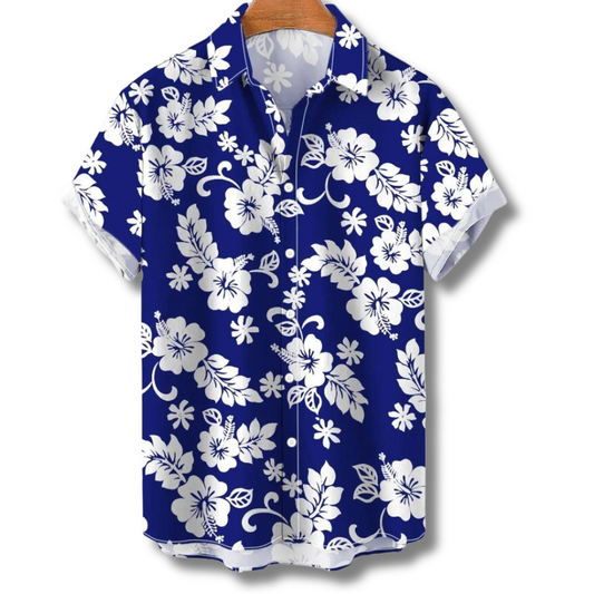 "Camicia Hawaii uomo con stampe tropicali colorate, tessuto leggero e vestibilità estiva, ideale per vacanze e feste."