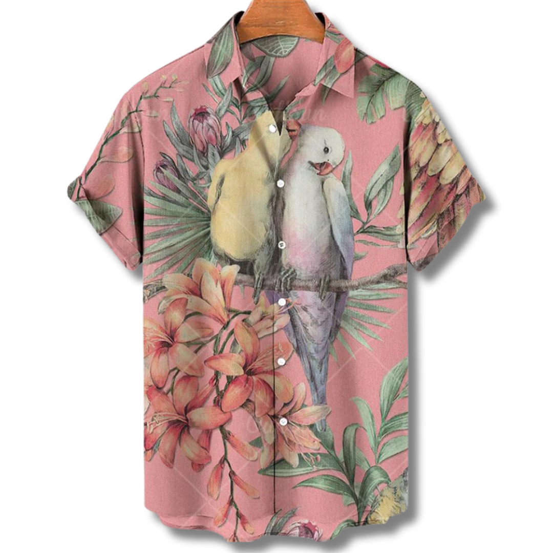 "Camicia Hawaii uomo con stampe tropicali colorate, tessuto leggero e vestibilità estiva, ideale per vacanze e feste."