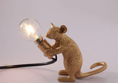 Whimsical mouse table lamp, a charming accent light. Unique home decor & novelty gift.