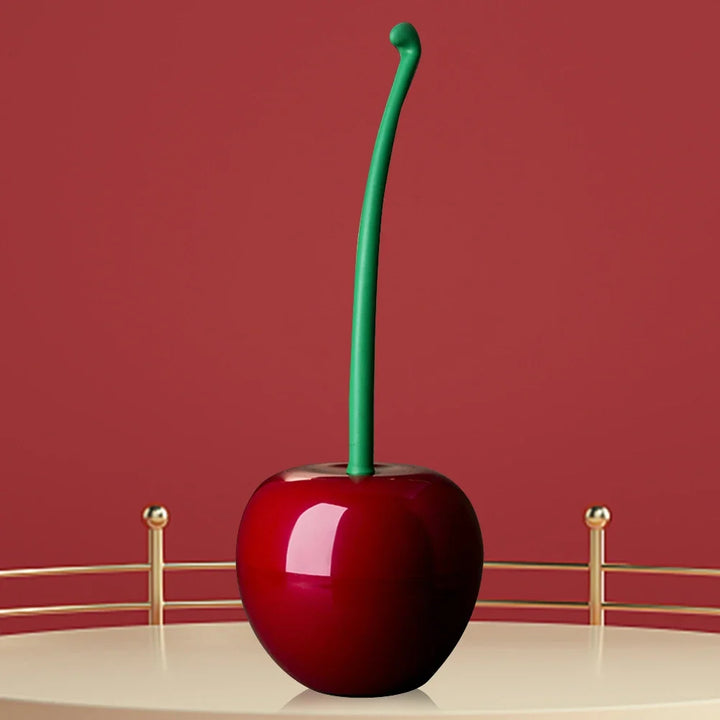 Fun Cherry Bomb toilet brush: a red & black bathroom cleaning tool for scrubbing and maintaining a fresh, hygienic home.