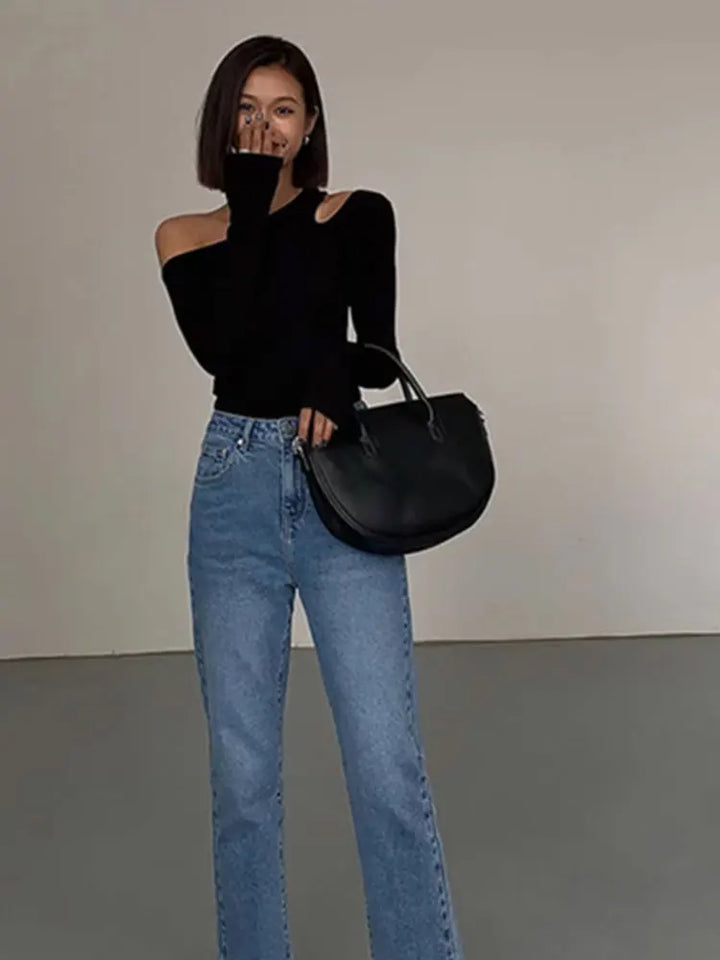 Trendy women's off-shoulder long sleeve black top, featuring effortless style & chic design for fashion-forward comfort.