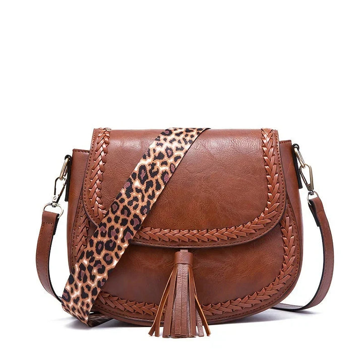Everyday brown women's saddle bag with beautiful tassel. A practical and chic crossbody.