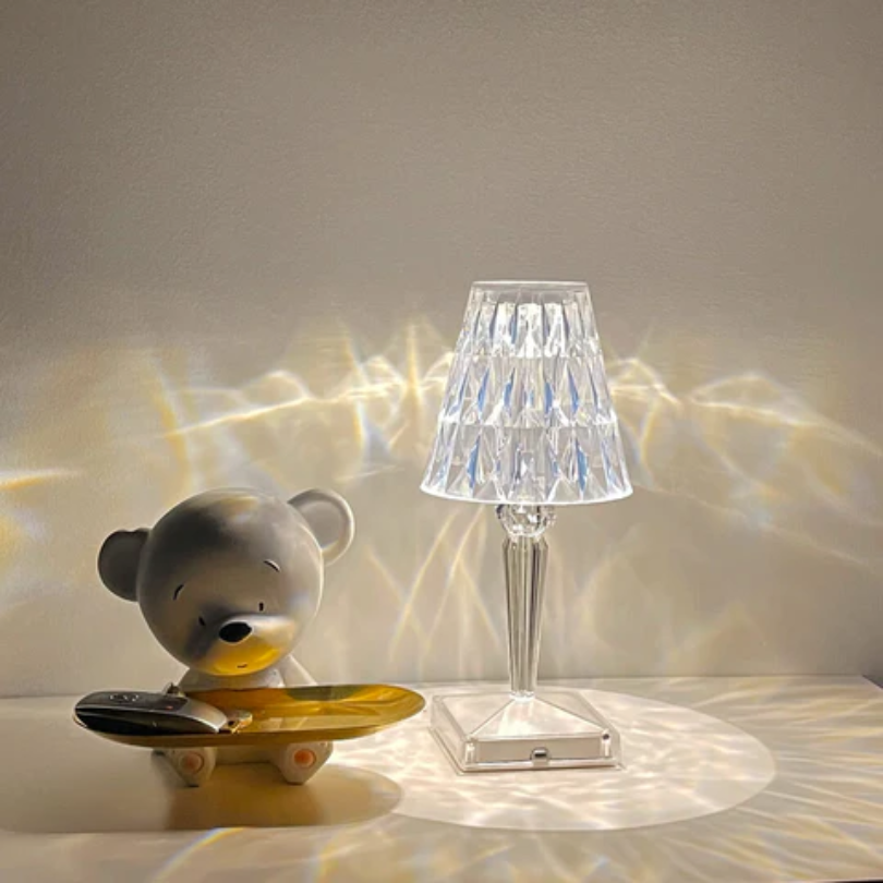 Decorative crystal table lamp, modern lighting solution enhancing elegant home decor.
