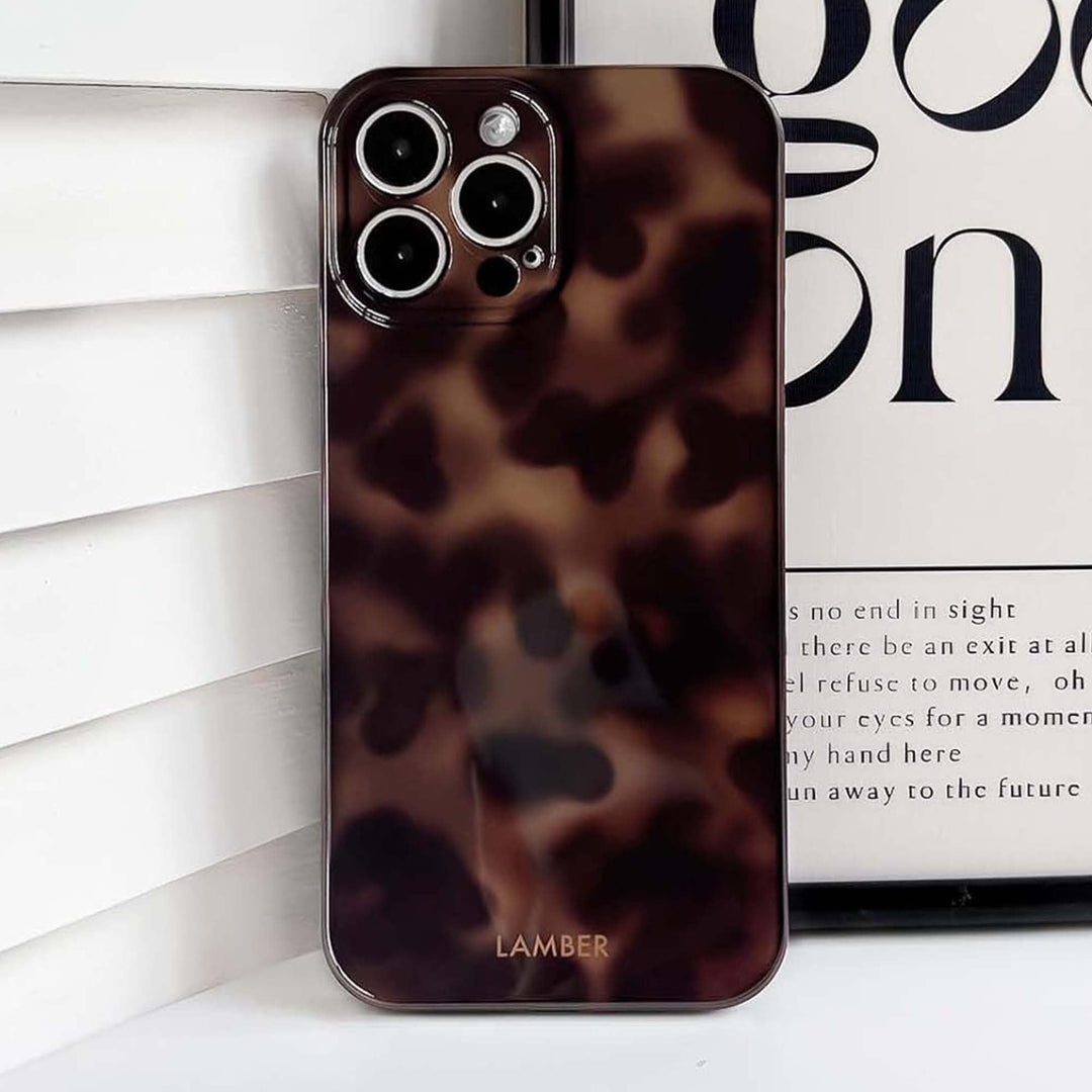 Stylish protective tortoiseshell glass iPhone case, scratch-resistant TPU for defense & fashion.