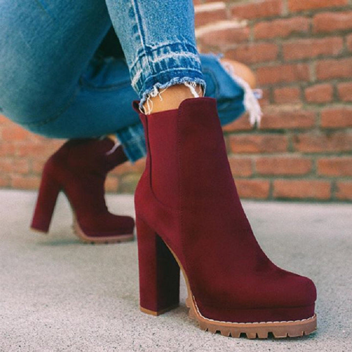 Comfortable slip-on women's ankle boots featuring a chic platform and sturdy block heel for versatile styling.