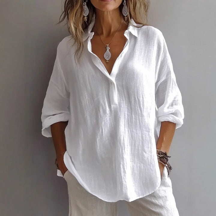 Chic women's button-up shirt with flowing wide sleeves, relaxed fit for casual summer fashion.
