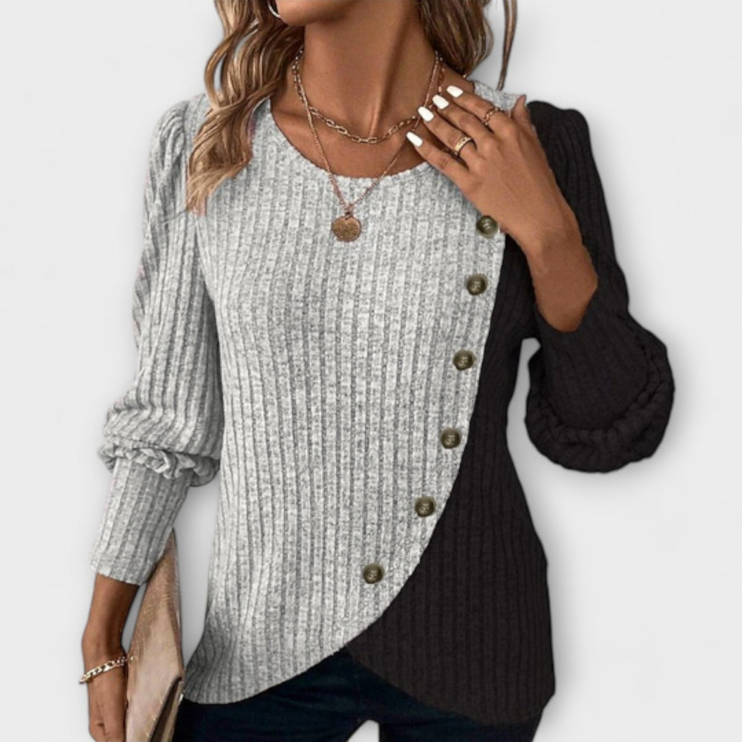 Chic women's colorblock blouse with asymmetric hem. Stylish long sleeve top for modern, elegant fashion.