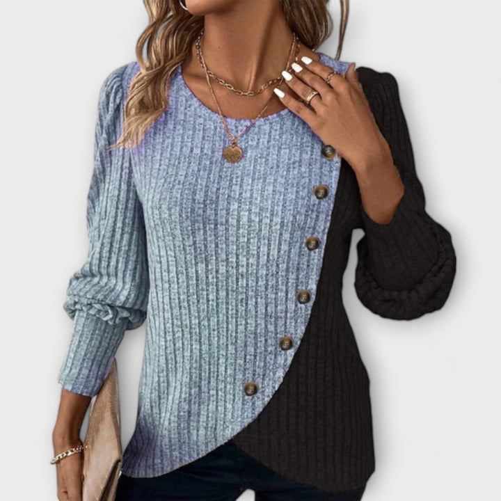 Versatile women's long sleeve top. Modern colorblock blouse with asymmetric detail for casual or elegant wear.