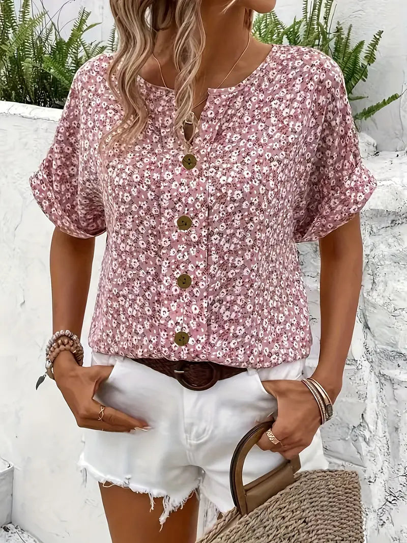 Back view of a women's loose fit floral blouse, highlighting its effortless comfort for everyday chic fashion.