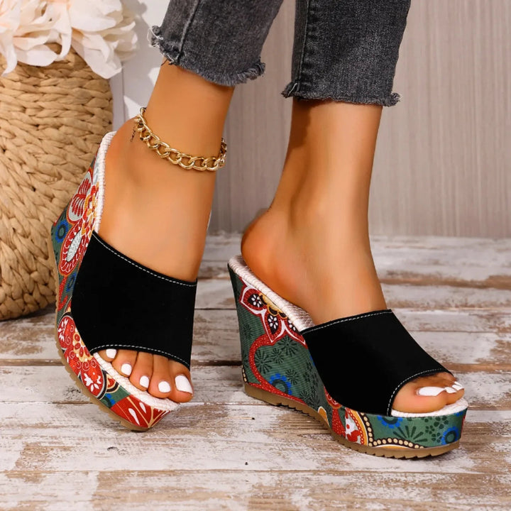 Fashion-forward women's floral wedge sandals. Slip-on footwear designed for elegance and all-day comfort.