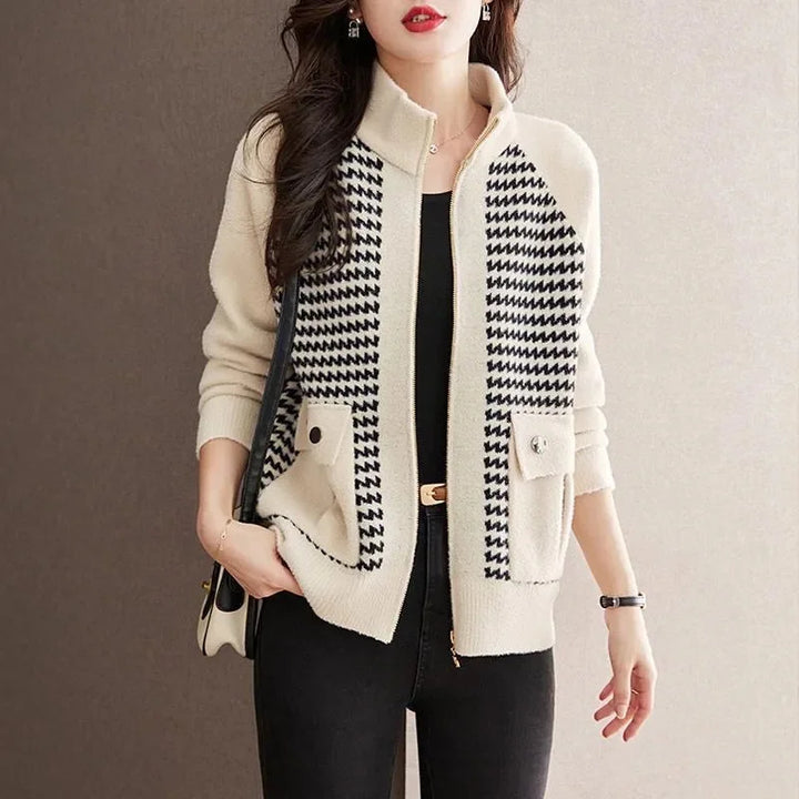 Chic women's houndstooth zip jacket. Stylish outerwear for elegant layering, perfect for versatile fashion.