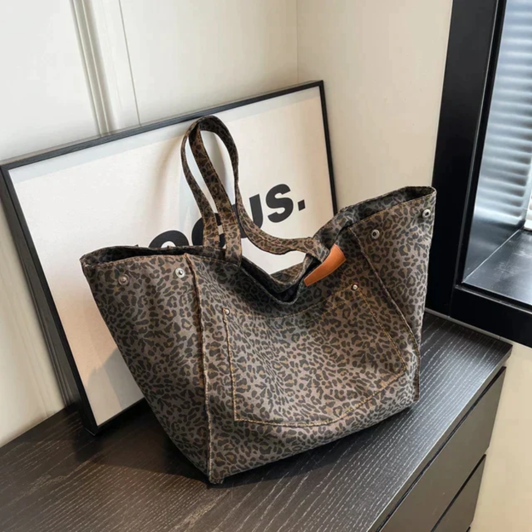 Fashionable women's shoulder bag with vibrant leopard print, perfect as a chic everyday purse.