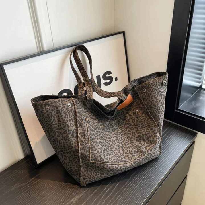 Fashionable women's shoulder bag with vibrant leopard print, perfect as a chic everyday purse.
