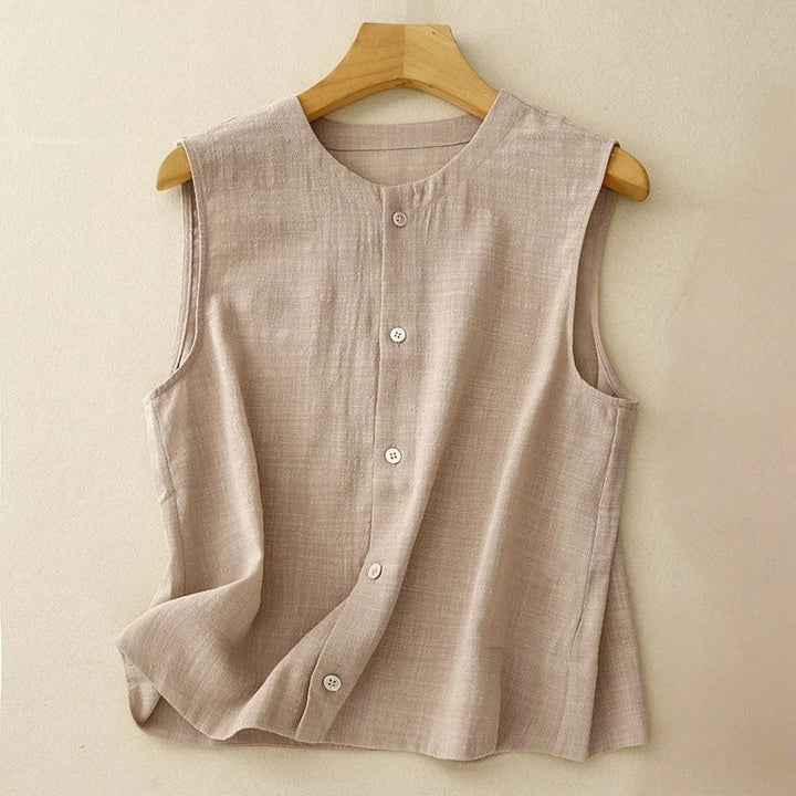 Versatile light brown sleeveless blouse for women, featuring a modern asymmetrical hem & stylish button accents.