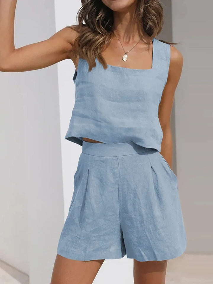 Fashionable women's sleeveless crop top and shorts set, a comfortable two-piece summer outfit for relaxed wear.