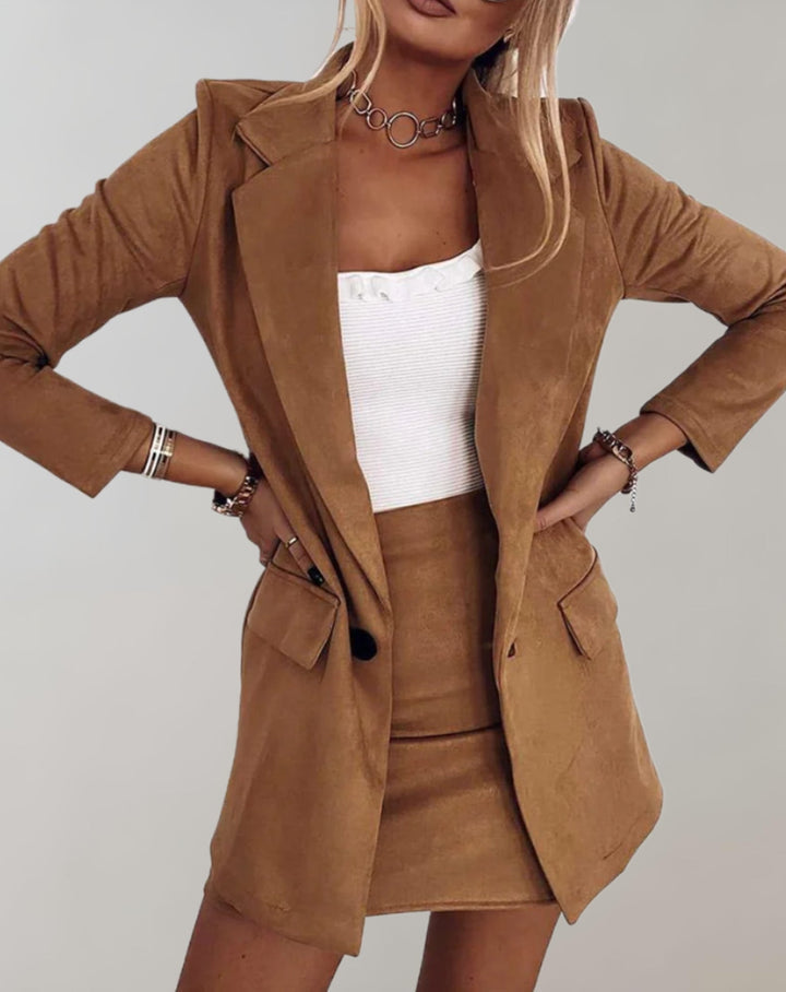 Elegant women's two-piece suit with tailored blazer & mini skirt, a versatile and chic ensemble for any event.