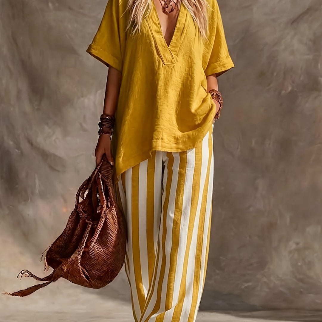 Fashionable women's two-piece: V-neck short sleeve top and stylish striped wide-leg pants. Casual summer elegance.