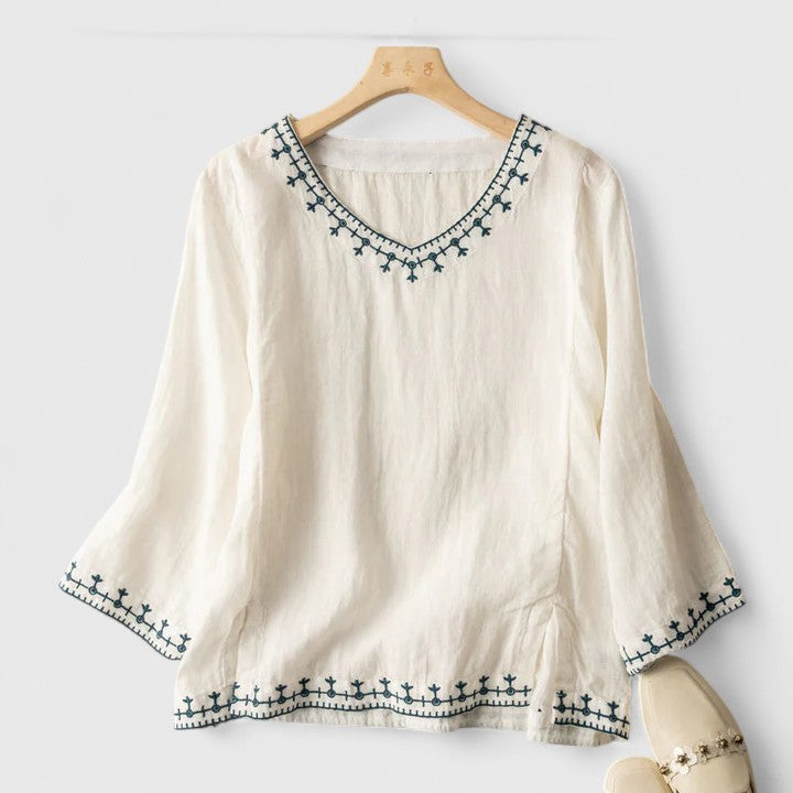 Elegant women's v-neck blouse with long sleeves. Perfect chic top for comfortable office & casual wear.