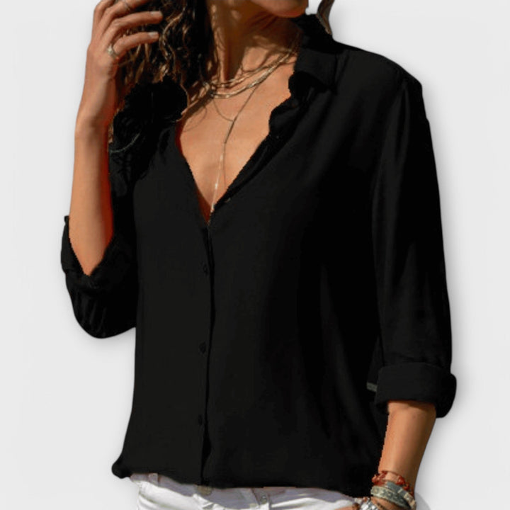 Sophisticated women's long-sleeve blouse, an essential for office elegance and stylish comfort.