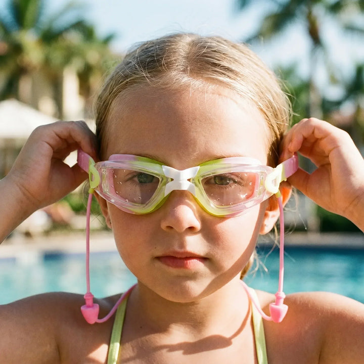 Children's anti-fog swim goggles with earplugs for clear underwater vision & ear protection in the pool.