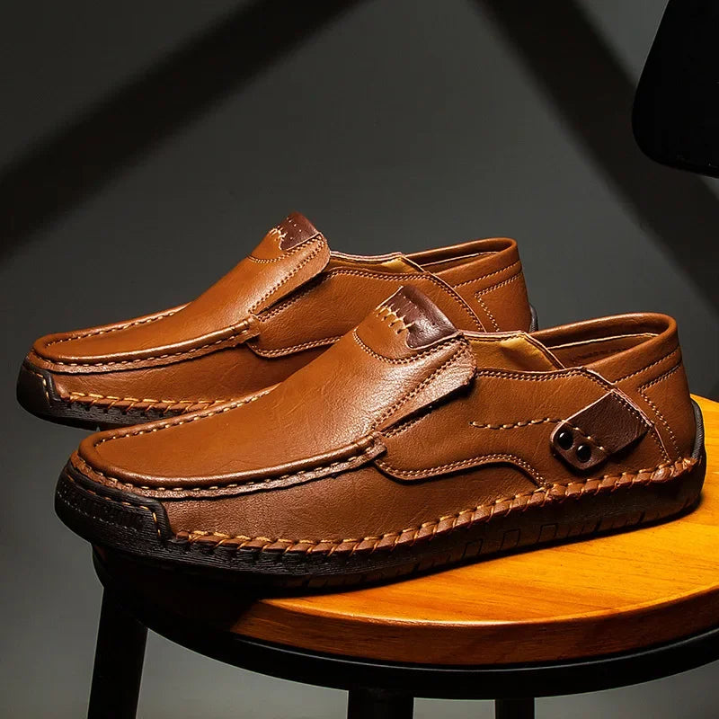 Classic men's black leather slip-on loafers, perfect for ultimate comfort & timeless style, ideal for everyday wear.