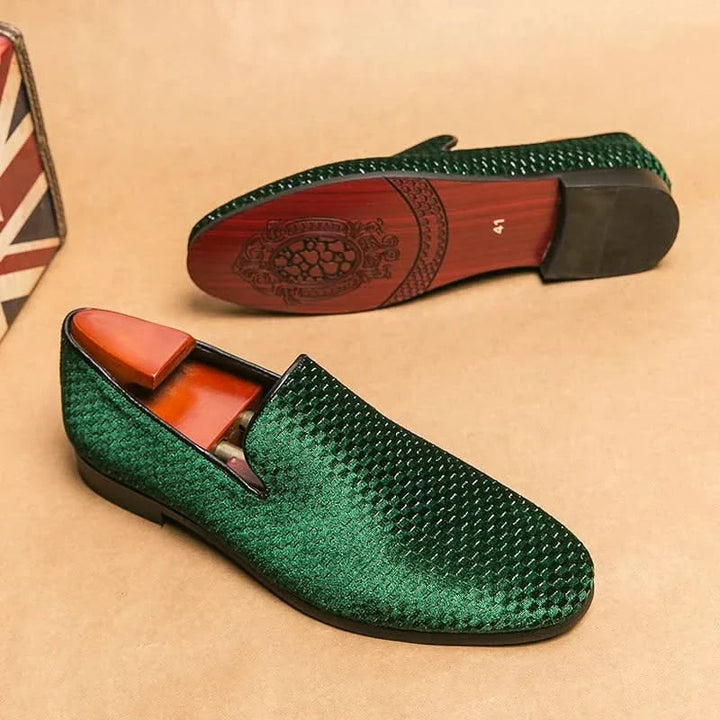 Classic men's black slip-on loafers, elegant & comfortable for formal or casual wear.