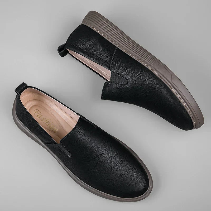 Timeless men's slip-on loafers in a sleek design. Comfortable and stylish dress shoes for any modern man.