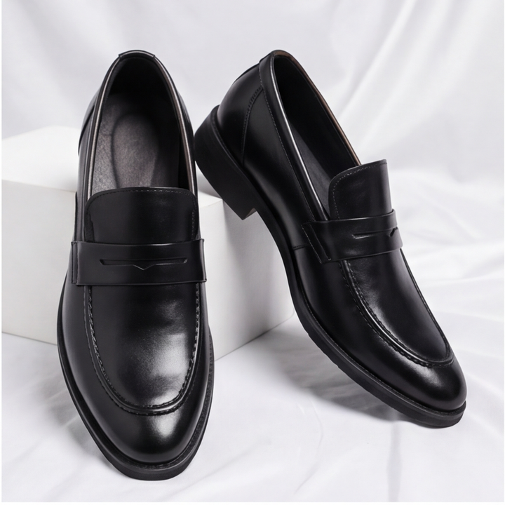 Detailed view of men's classic penny loafers, highlighting quality leather and traditional design.