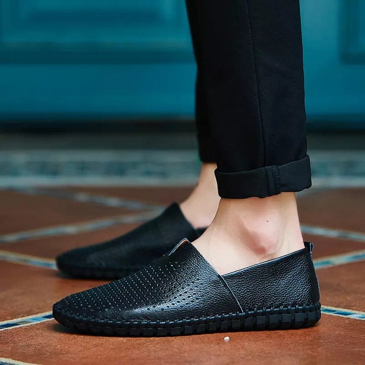Smart men's perforated loafers; the ultimate slip-on shoe for sophisticated comfort.