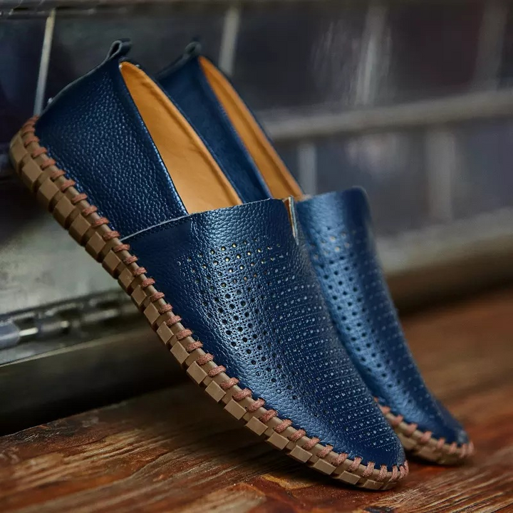 Stylish men's perforated slip-on loafers, perfect for casual or dressy outfits.