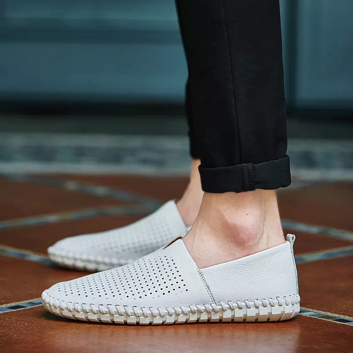 Modern men's fashion: perforated slip-on loafers for a smart, comfortable look.