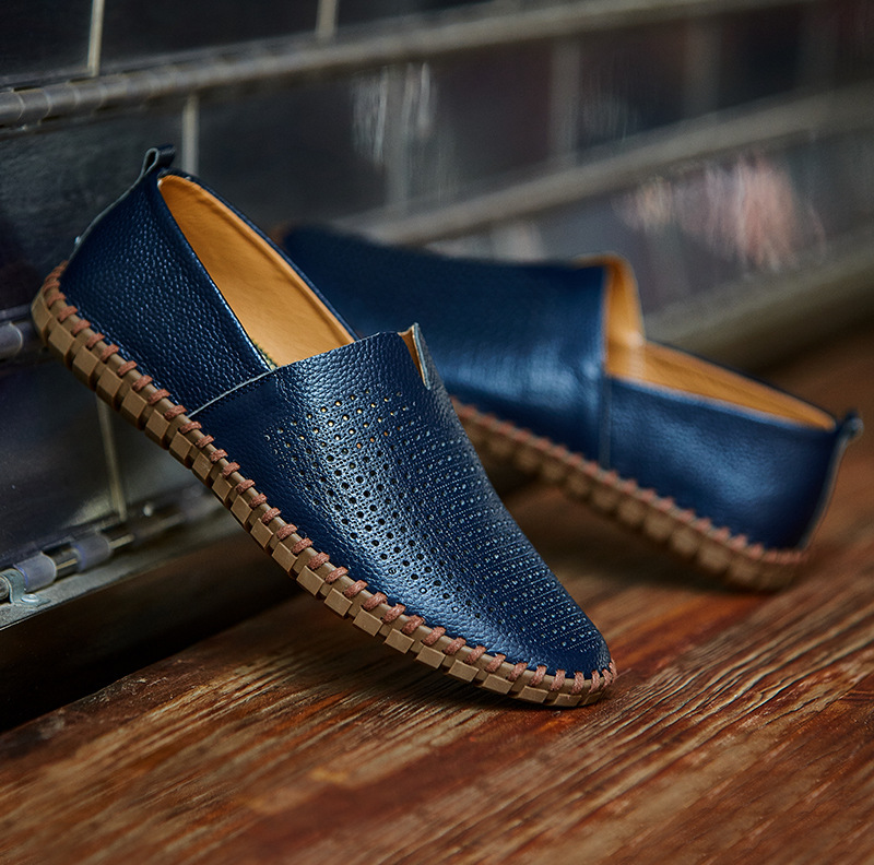 Hand-stitched men's loafers with perforated design, offering breathability & comfort.