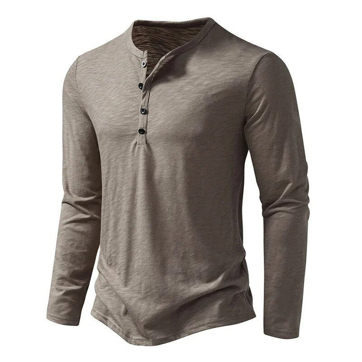Versatile men's long sleeve henley top with button placket, ideal for casual wear.