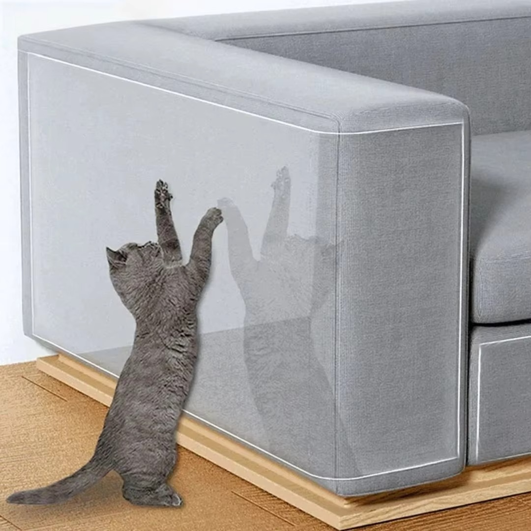 Clear self-adhesive cat scratch protector for furniture. Durable sofa shield against pet claws.