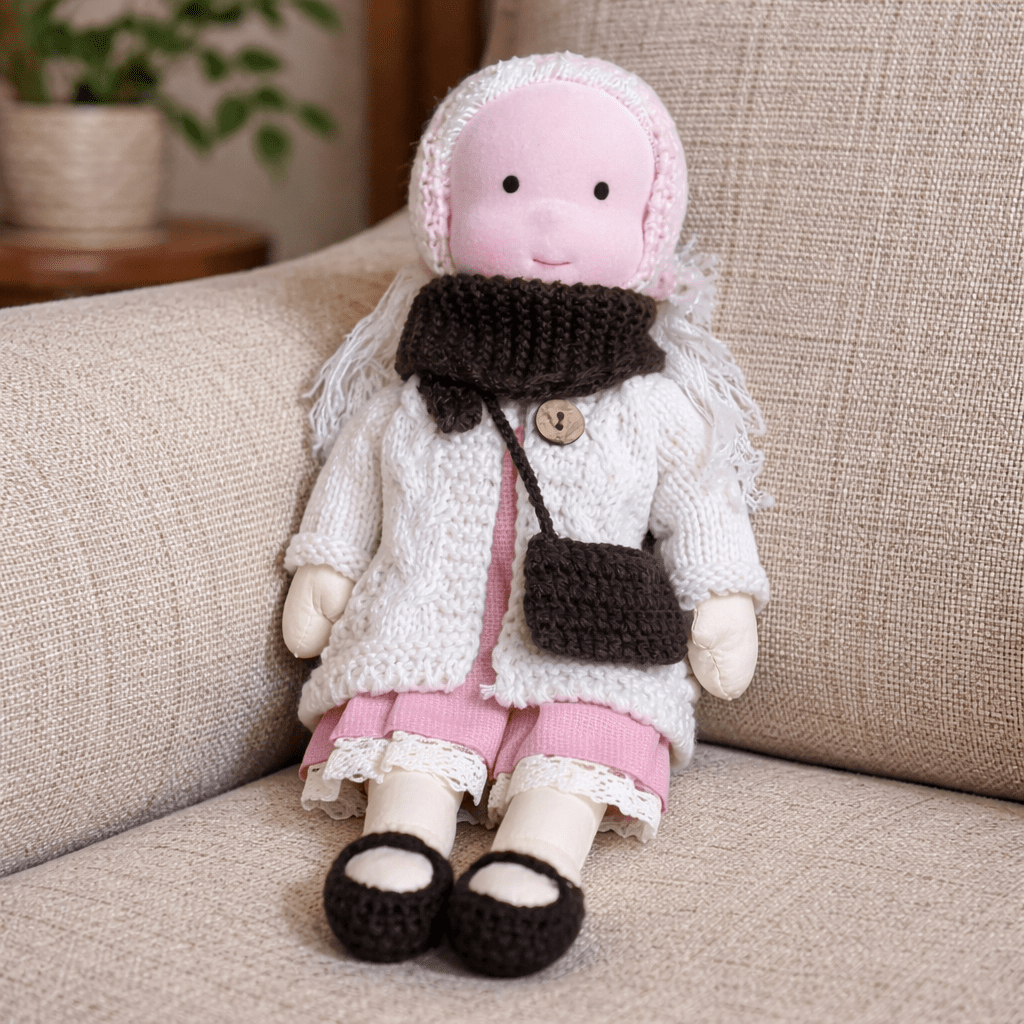 Soft cotton Waldorf doll for kids, an artisan-crafted toy promoting imaginative development.