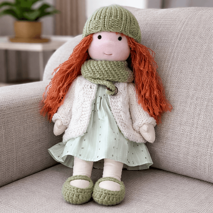 Soft, plush artisan-crafted Waldorf doll made from cotton, ideal for creative children.