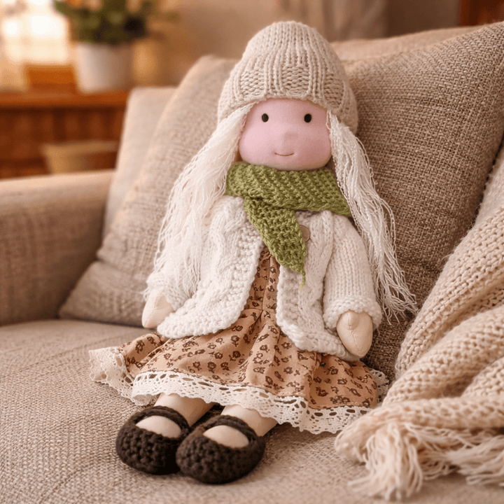 Gentle cotton Waldorf doll, a handmade developmental toy for toddlers and children.