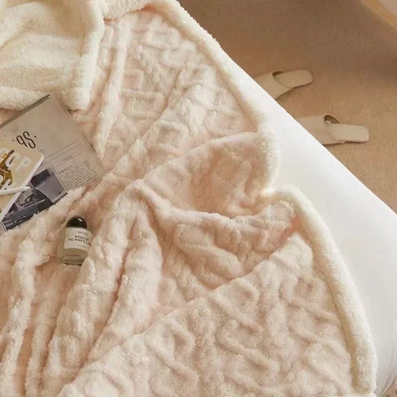 Detailed shot of a soft lambswool blanket's plush fibers, highlighting its superior warmth & cozy texture.