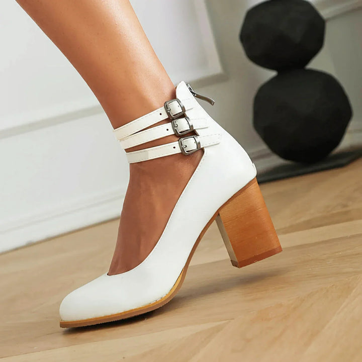 Detail shot of women's block heels, highlighting the elegant strappy design.
