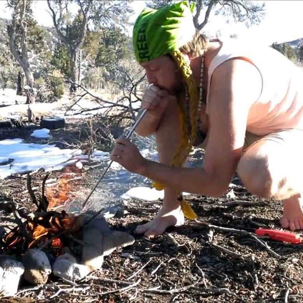 Outdoor camping gear: collapsed stainless steel blowpipe, a portable fire starter accessory