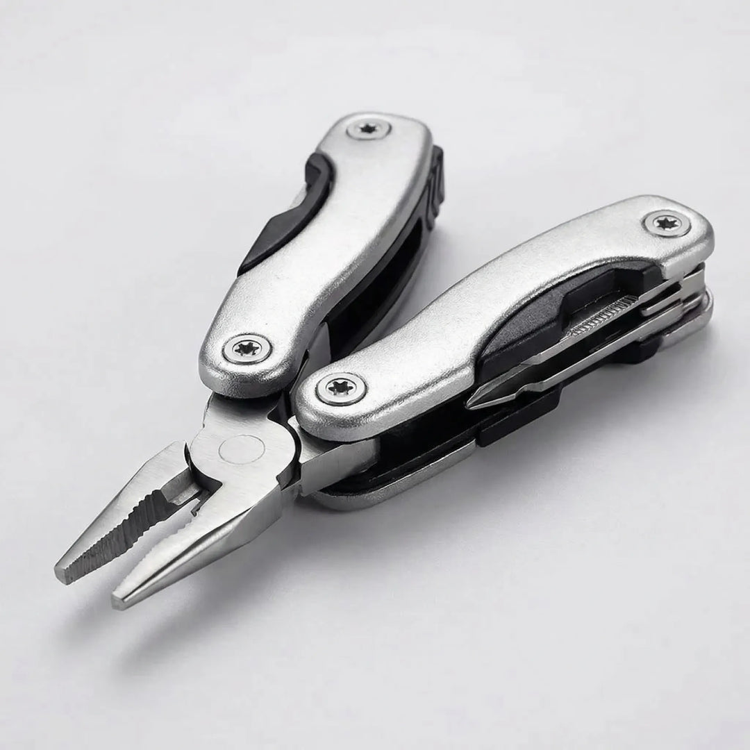 Unisex 9-in-1 folding multi-tool in hand, ready for outdoor camping, hiking, and survival tasks.