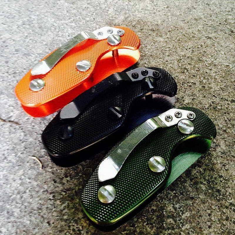 Silver aluminum EDC key organizer, folded to save pocket space, showing easy key access.
