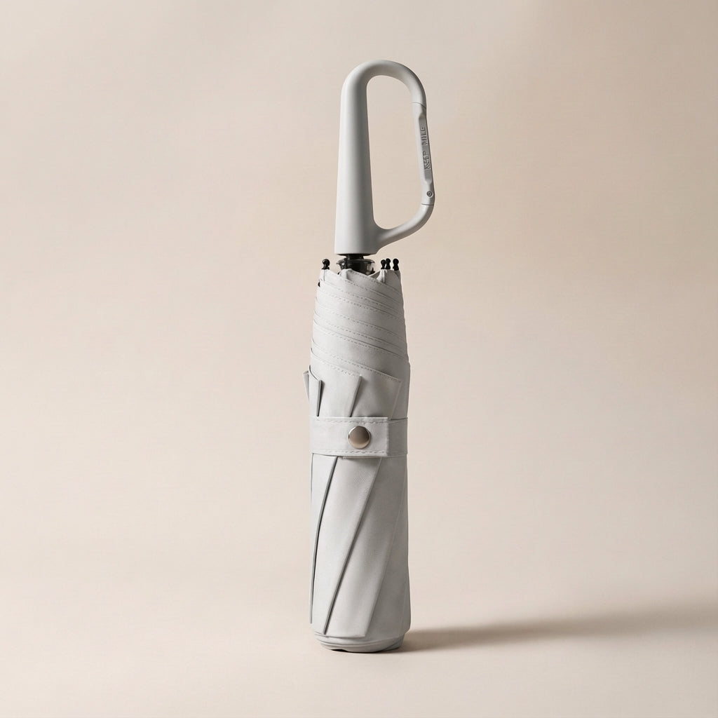 Lightweight unisex travel umbrella with a robust clip, offering protection from rain and harmful UV rays.